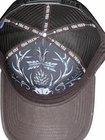 Black cap with white skull design and 'Feral Folk' branding on a white background