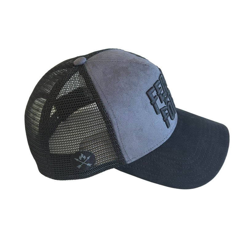 Feral Folk Trucker hat with mesh back and solid brim on a white background